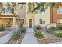 Attractive townhome exterior with landscaped walkway at 4650 Ranch House Rd # 42, North Las Vegas, NV 89031