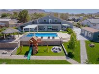 Luxury home with a large pool, playground, and spacious backyard at 836 San Eduardo Ave, Henderson, NV 89002