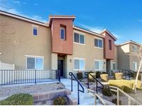 Modern two-story townhome with attached garage and landscaped front yard at 12124 Mojave Gold Rd # 2, Las Vegas, NV 89183