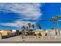 Charming single-story home with desert landscaping, solar panels, and palm trees at 132 Continental Ave, Henderson, NV 89015