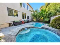Relaxing backyard oasis with inviting pool, spa, and ample patio space at 334 Sea Rim Ave, Las Vegas, NV 89148