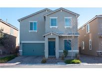 Two-story house featuring a teal garage door and landscaping at 5480 Enchanted Rose St, Las Vegas, NV 89148