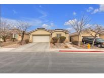 Single-story house with a two-car garage and landscaped front yard at 6054 Sierra Medina Ave, Las Vegas, NV 89139