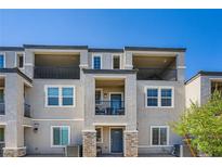 Contemporary townhome exterior boasting private balconies and modern architectural details at 6521 Taffrail Ave, Las Vegas, NV 89118