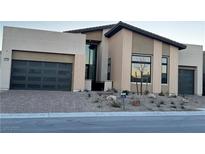 Modern two-story house with attached garage and desert landscaping at 10739 Agate Cliffs Ave, Las Vegas, NV 89135