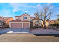 Two-story house with three-car garage and landscaped yard at 1105 Thornfield Ln, Las Vegas, NV 89123