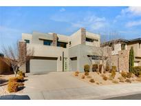 Modern two-story home with attached garage and landscaped front yard at 10286 Jade Gardens Dr, Las Vegas, NV 89135