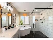 Spa-like bathroom with soaking tub, walk-in shower, and modern fixtures at 2924 Rain Lily Ct, Las Vegas, NV 89117