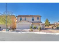 Two-story house with attached garage and landscaped front yard at 3257 Aiken St, North Las Vegas, NV 89032