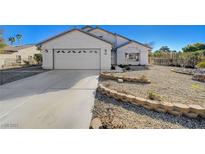 Two-story house with landscaped yard and a two-car garage at 5236 Woodlawn Ln, Las Vegas, NV 89130