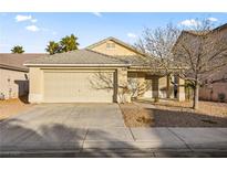 Charming single-story home with a two-car garage and low-maintenance landscaping at 5804 Sassa St, Las Vegas, NV 89130