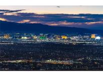 Stunning aerial view of city skyline at sunset at 591 Overlook Rim Dr, Henderson, NV 89012