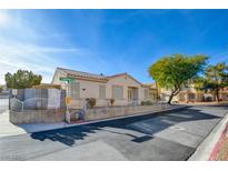 Single-story house with front yard and well-maintained landscaping at 7741 Orchard Wood Ct, Las Vegas, NV 89131