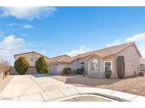 Single-story home with a tile roof, driveway, and landscaping at 7859 Lisa Marie Ct, Las Vegas, NV 89113