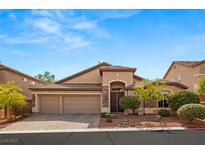 Single-story house with two-car garage, landscaping, and a brick facade at 10093 Golden Bluff Ave, Las Vegas, NV 89148