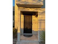 Inviting entryway with a black metal door and a decorative doormat at 4241 Gannet Cir # 205, Las Vegas, NV 89103