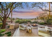 Serene backyard oasis with fire pit and mountain views at 4541 Largo Cantata St, Las Vegas, NV 89135