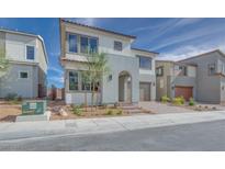 Two-story home with modern design, attached garage, and landscaping at 6828 Pacific Robin St, North Las Vegas, NV 89084