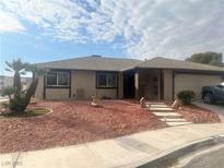 Single-story house with red rock landscaping and a two-car garage at 5079 Reno Ct, Las Vegas, NV 89119