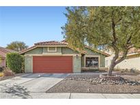 Charming single-story home with well-maintained front yard and attached two-car garage at 7277 Abbeyville Dr, Las Vegas, NV 89119