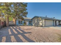 Single-story house with a garage and a yard at 2620 Shiloh Way, North Las Vegas, NV 89030