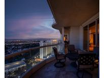 Evening view of city skyline from private balcony with seating area at 2777 Paradise Rd # 3701, Las Vegas, NV 89109