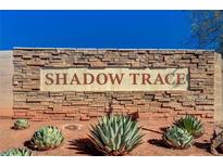 Stone entrance to Shadow Trace community featuring desert landscaping and clear blue sky at 3517 Colby Creek Ave, North Las Vegas, NV 89081