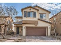 Two-story house with brown garage door and brick walkway at 4944 Guysborough St, Las Vegas, NV 89148