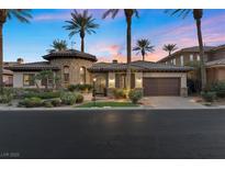 Charming single-story home boasts stone accents, mature palm trees, and a two-car garage, creating curb appeal at 51 Avenida Sorrento, Henderson, NV 89011