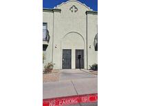 Building exterior featuring Spanish-style architecture and a two-story design at 7090 Burcot Ave # B32, Las Vegas, NV 89156