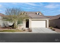 One-story home with attached garage, desert landscaping, and neutral color palette at 1348 Mariposa Way, Mesquite, NV 89027