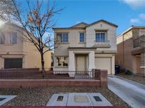 Two-story house with attached garage and small front yard at 3615 American Pie Ct, Las Vegas, NV 89129