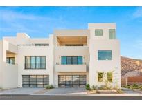 Modern luxury home with sleek design and two-car garage at 394 Solitude Peak Ln, Henderson, NV 89012