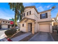 Two-story house with attached garage and front yard at 585 Dairy Creek Ave, Las Vegas, NV 89183