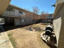 Apartment complex courtyard with BBQ grills and small play area at 212 Orland St # 26, Las Vegas, NV 89107