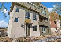 Modern three-story townhome with neutral colors and balcony at 4141 Sunrise Flats St, Las Vegas, NV 89135