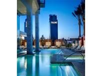 Luxury resort-style pool and spa with comfortable lounge chairs at 4381 W Flamingo Rd # 1909, Las Vegas, NV 89103