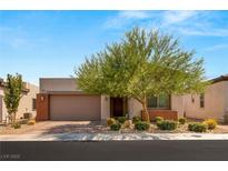 Single-story home with desert landscaping and two-car garage at 8606 Dusty Quail Dr, Las Vegas, NV 89148