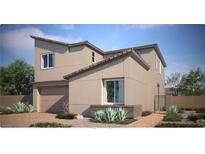 Two-story home with a modern design, attached garage, and desert landscaping at 9268 Copernicus Ave, Las Vegas, NV 89143