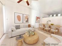 Virtually staged living room with dining area, featuring modern furniture and decor at 1405 Vegas Valley Dr # 92, Las Vegas, NV 89169