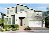 Modern two-story home with landscaped front yard and attached garage at 210 Abbey Hill St, Henderson, NV 89012