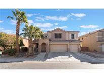 Two-story house with a three-car garage and palm trees at 6916 Snow Finch St, North Las Vegas, NV 89084