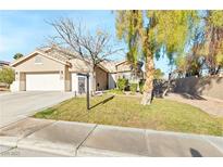 Single-story house with a two-car garage and a landscaped front yard at 279 Windsong Echo Dr, Henderson, NV 89012