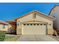 One-story house with attached garage and neutral color scheme at 3060 Lapis Beach Dr, Las Vegas, NV 89117