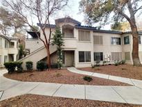 Two-story building exterior with walkway and landscaping at 3083 Casey Dr # 101, Las Vegas, NV 89120