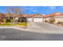 Single-story home with two-car garage and landscaped front yard at 4182 Bottiglia Ave, Las Vegas, NV 89141