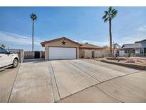 Single-story home with a spacious driveway and landscaped front yard at 659 Glenwood Ln, Henderson, NV 89002