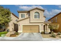 Two-story house with attached garage and landscaping at 9240 Long Grove Ave, Las Vegas, NV 89149