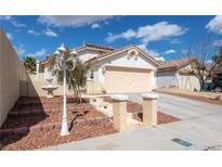 Single-story house with a two-car garage and well-maintained front yard at 9366 W Viking Rd, Las Vegas, NV 89147