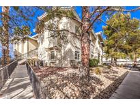 Attractive exterior of a two-story building with landscaping and walkway at 3320 S Fort Apache Rd # 125, Las Vegas, NV 89117